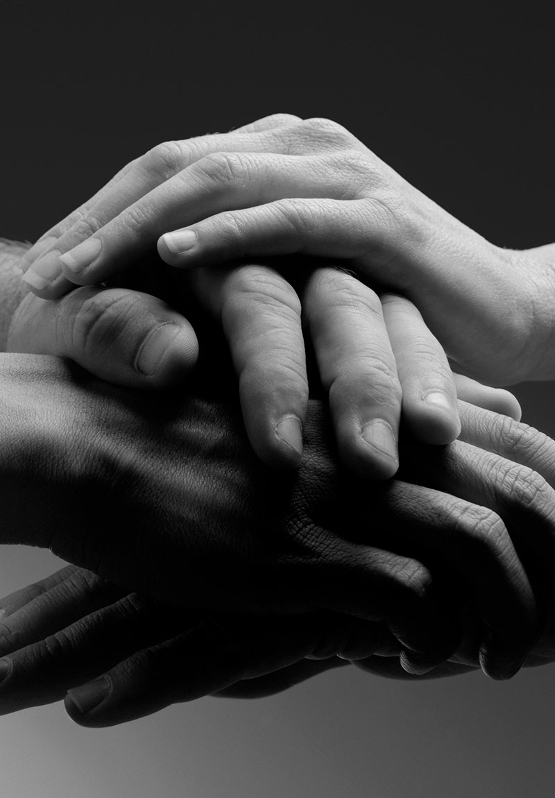Hands gently stacked on other hands concierge medicine